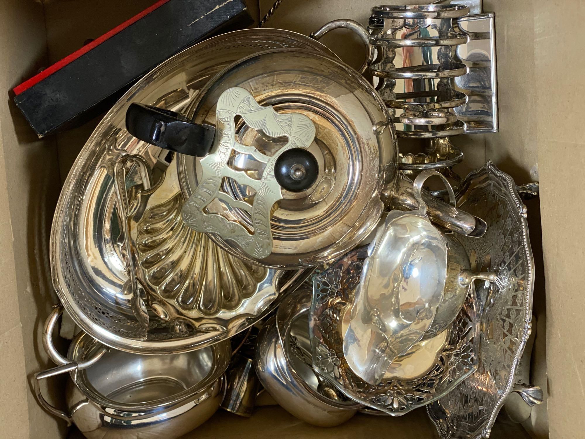 A silver sauce jug, a pair of Victorian plated entree dishes with covers and other plated wares